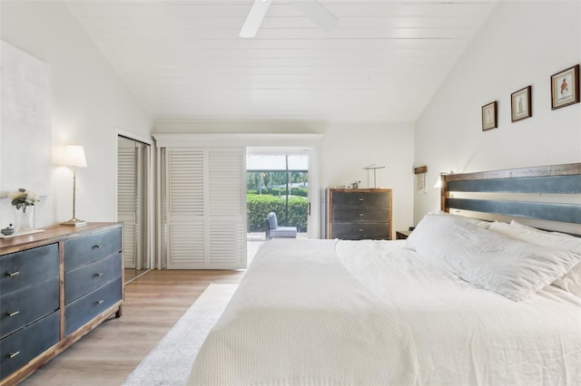 bedroom with ceiling fan, vaulted ceiling, light wood-style flooring, and access to outside