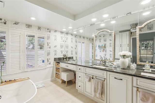 full bathroom with vanity, tile patterned floors, recessed lighting, a soaking tub, and baseboards