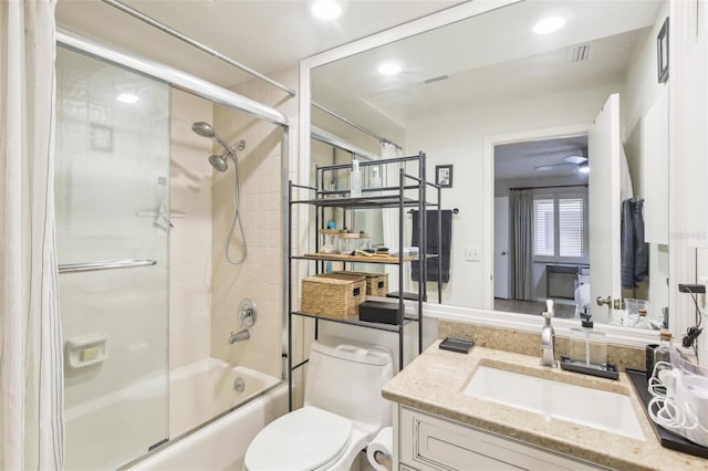 full bath featuring toilet, shower / bath combination with glass door, visible vents, vanity, and recessed lighting