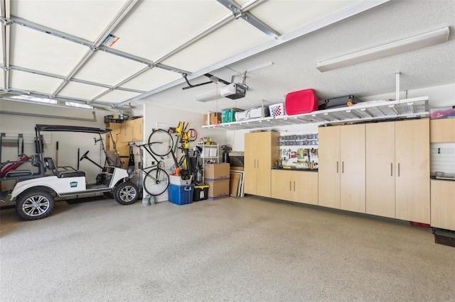 garage featuring a garage door opener