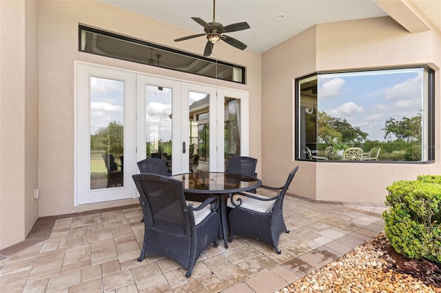view of patio / terrace featuring french doors, ceiling fan, and outdoor dining area