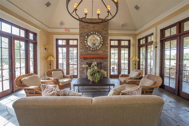 living room featuring a wealth of natural light, wooden ceiling, and french doors