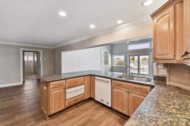 17 Bellevue Dr, Treasure Island, FL 33706 - kitchen with white dishwasher, a warming drawer, a sink, wood finished floors, and crown molding