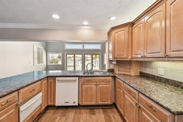 17 Bellevue Dr, Treasure Island, FL 33706 - kitchen featuring a sink, a warming drawer, white dishwasher, crown molding, and wood finished floors