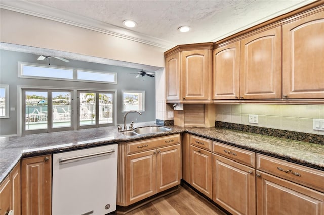 17 Bellevue Dr, Treasure Island, FL 33706 - kitchen featuring white dishwasher, a sink, ceiling fan, decorative backsplash, and crown molding