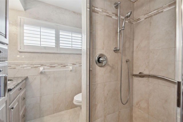 17 Bellevue Dr, Treasure Island, FL 33706 - bathroom with a stall shower, toilet, and vanity
