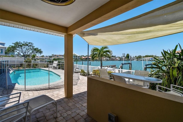 17 Bellevue Dr, Treasure Island, FL 33706 - community pool featuring a water view and a patio area