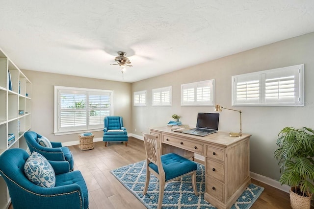17 Bellevue Dr, Treasure Island, FL 33706 - office space with a ceiling fan, baseboards, and wood finished floors
