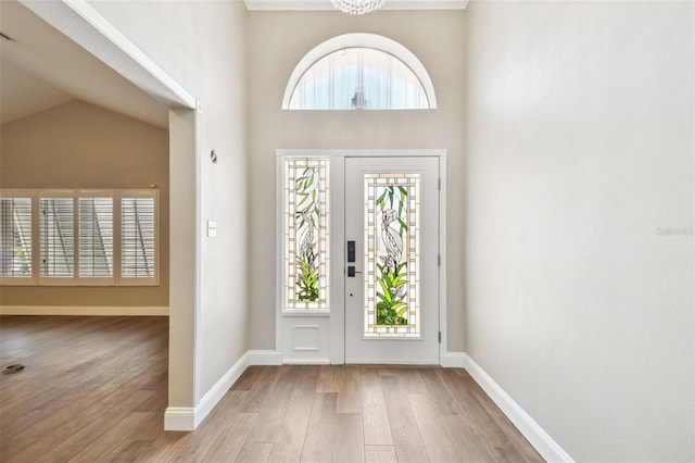 17 Bellevue Dr, Treasure Island, FL 33706 - entrance foyer featuring plenty of natural light, wood finished floors, and baseboards
