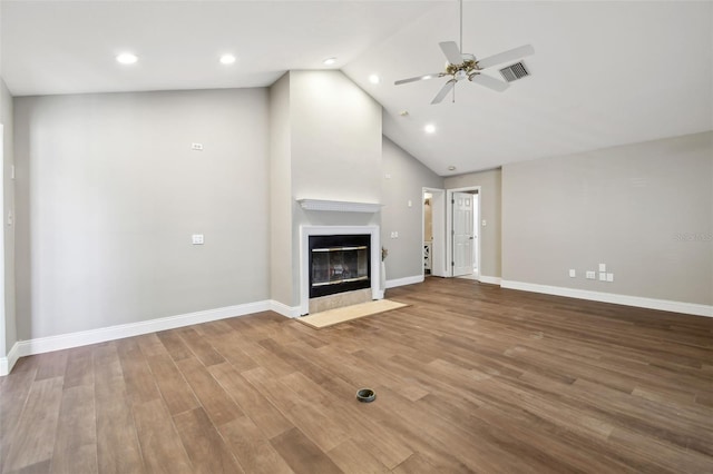 17 Bellevue Dr, Treasure Island, FL 33706 - unfurnished living room featuring recessed lighting, ceiling fan, a fireplace with flush hearth, wood finished floors, and baseboards