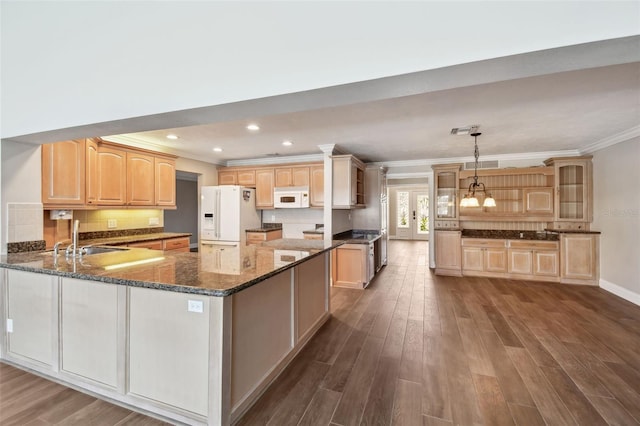 17 Bellevue Dr, Treasure Island, FL 33706 - kitchen with white appliances, a sink, crown molding, light brown cabinets, and dark wood-style floors