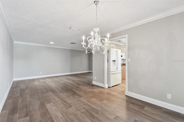 17 Bellevue Dr, Treasure Island, FL 33706 - unfurnished dining area with a chandelier, dark wood-style flooring, baseboards, and ornamental molding