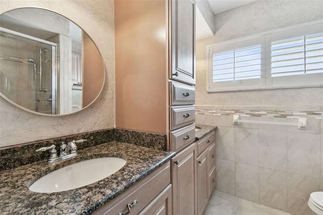 17 Bellevue Dr, Treasure Island, FL 33706 - bathroom with vanity, a shower stall, and toilet