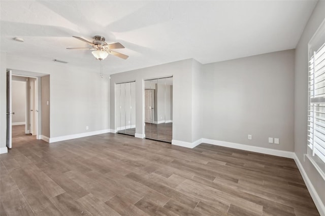 17 Bellevue Dr, Treasure Island, FL 33706 - empty room featuring ceiling fan, baseboards, and wood finished floors