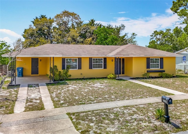 7280 Tarrytown Dr, Spring Hill, FL 34606 - ranch-style house featuring concrete driveway and an attached carport