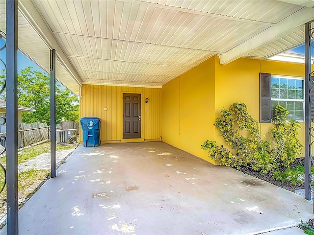 7280 Tarrytown Dr, Spring Hill, FL 34606 - view of patio / terrace with fence and an attached carport