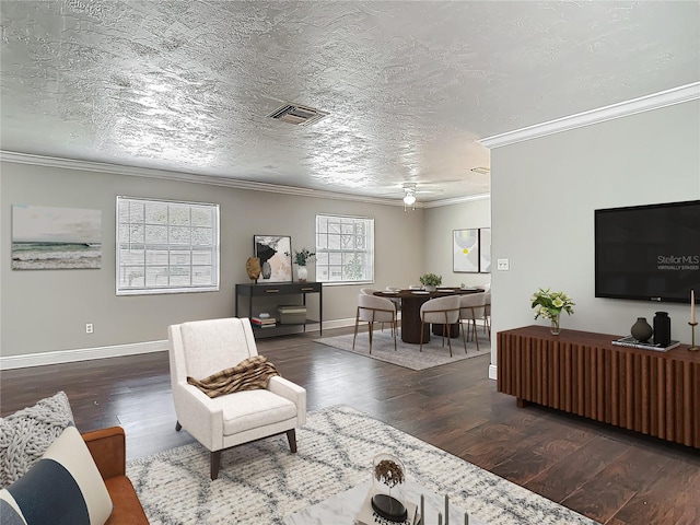 7280 Tarrytown Dr, Spring Hill, FL 34606 - living area featuring wood finished floors, ornamental molding, baseboards, visible vents, and a ceiling fan