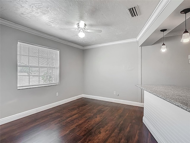 7280 Tarrytown Dr, Spring Hill, FL 34606 - spare room with dark wood-style floors, ceiling fan, crown molding, visible vents, and baseboards