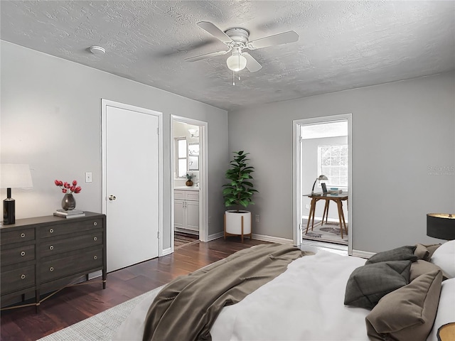 7280 Tarrytown Dr, Spring Hill, FL 34606 - bedroom featuring a textured ceiling, ensuite bath, a ceiling fan, and dark wood-type flooring
