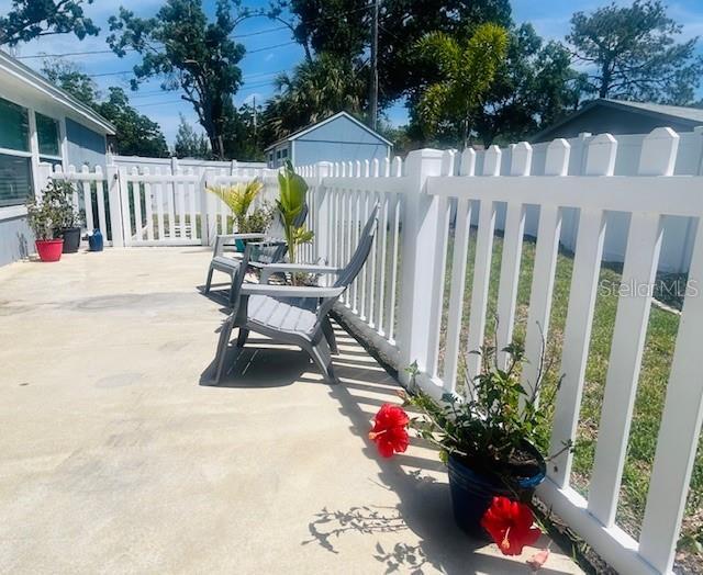 6401 30th Way N, Saint Petersburg, FL 33702 - view of patio / terrace featuring fence
