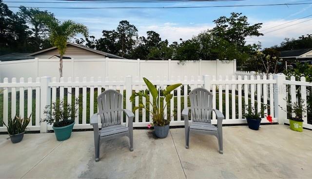 6401 30th Way N, Saint Petersburg, FL 33702 - view of patio / terrace featuring fence