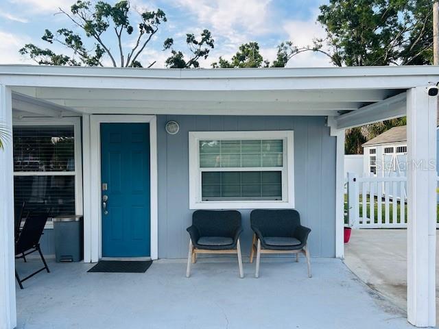 6401 30th Way N, Saint Petersburg, FL 33702 - doorway to property with a patio area and fence