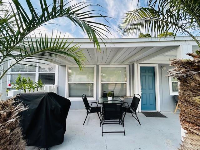 6401 30th Way N, Saint Petersburg, FL 33702 - view of patio featuring grilling area and outdoor dining space