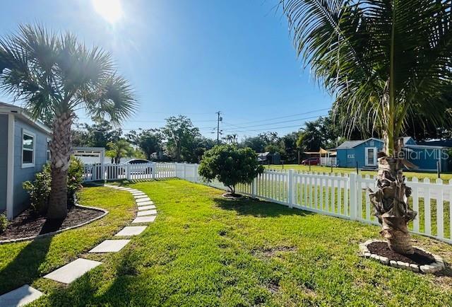 6401 30th Way N, Saint Petersburg, FL 33702 - view of yard featuring fence