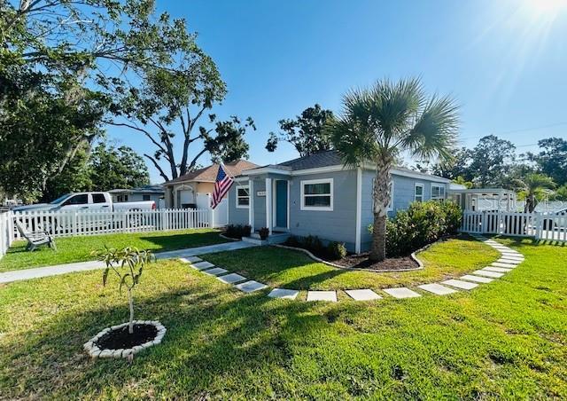 6401 30th Way N, Saint Petersburg, FL 33702 - view of front facade with a front yard and fence