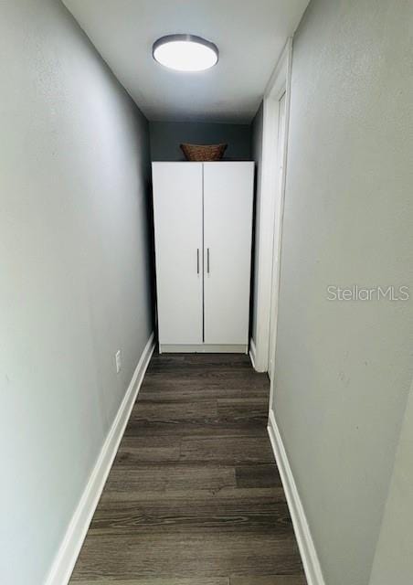 6401 30th Way N, Saint Petersburg, FL 33702 - corridor featuring baseboards and dark wood-style flooring