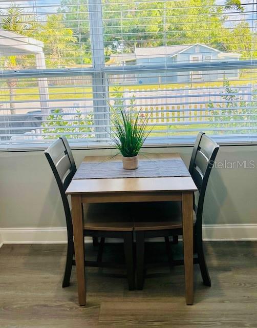6401 30th Way N, Saint Petersburg, FL 33702 - dining area featuring wood finished floors and baseboards