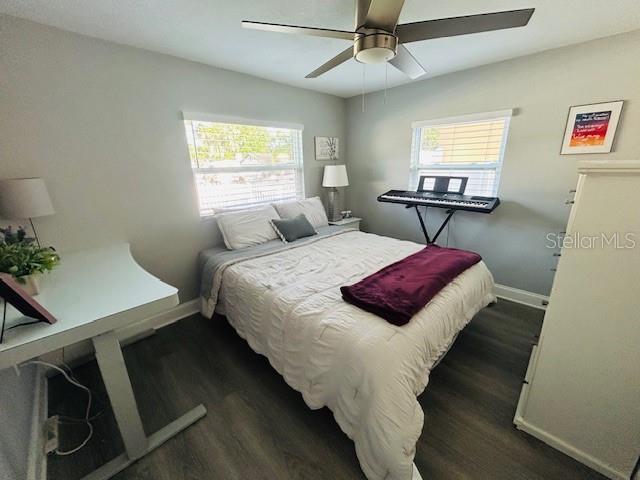 6401 30th Way N, Saint Petersburg, FL 33702 - bedroom with ceiling fan, baseboards, and dark wood-style floors