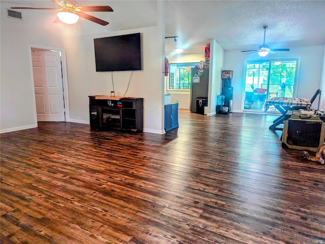 37654 Eiland Blvd, Zephyrhills, FL 33542 - living area featuring wood finished floors, visible vents, a ceiling fan, and baseboards