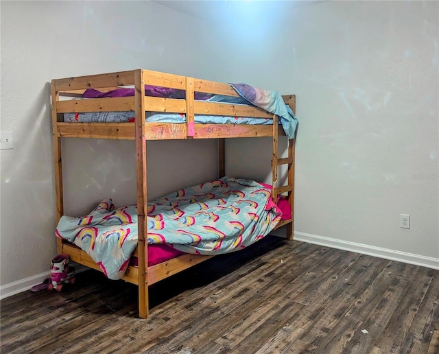 37654 Eiland Blvd, Zephyrhills, FL 33542 - bedroom with wood finished floors and baseboards