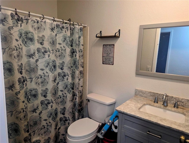37654 Eiland Blvd, Zephyrhills, FL 33542 - bathroom featuring toilet, vanity, and a shower with shower curtain