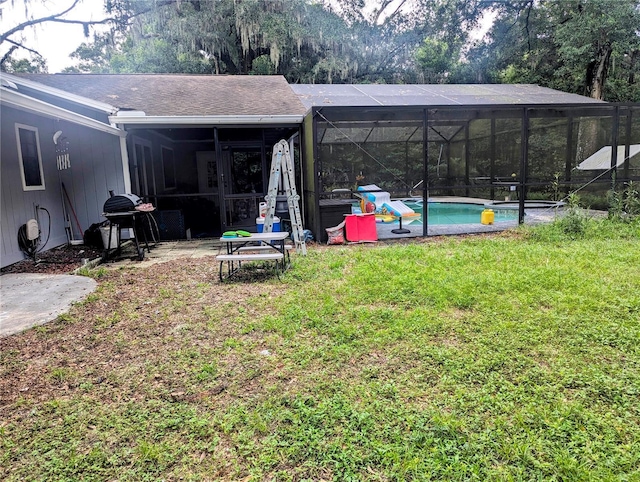37654 Eiland Blvd, Zephyrhills, FL 33542 - view of yard featuring an outdoor pool and glass enclosure