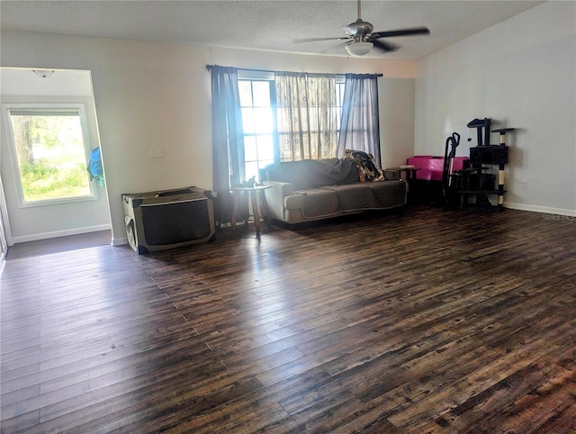 37654 Eiland Blvd, Zephyrhills, FL 33542 - bedroom featuring baseboards, ceiling fan, a textured ceiling, and dark wood-style flooring