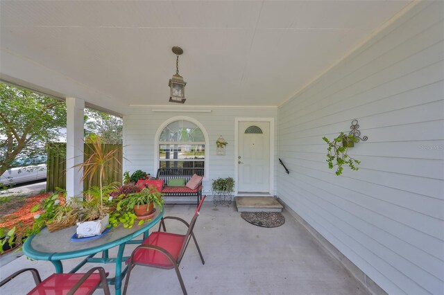 doorway to property with a porch