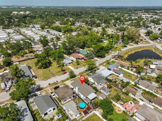 birds eye view of property with a water view and a residential view