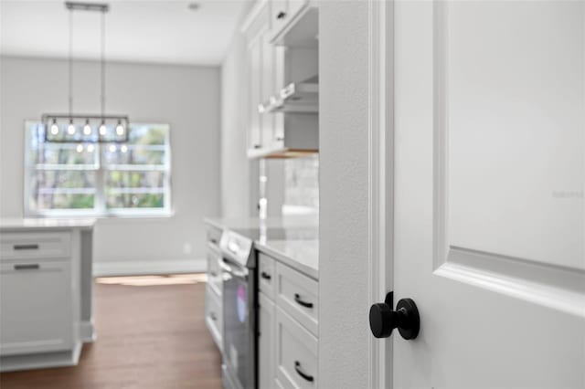 laundry area featuring dark wood-style flooring