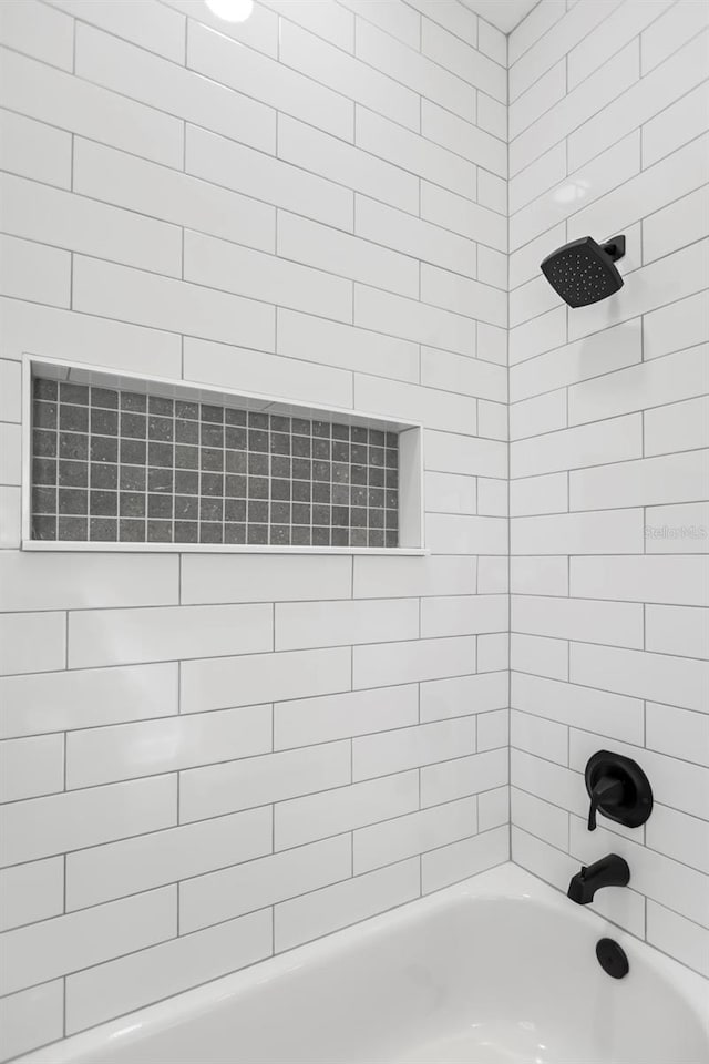full bath with shower / tub combination