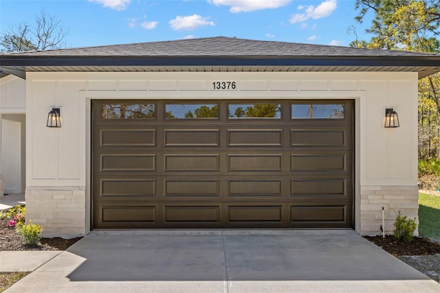 garage featuring driveway