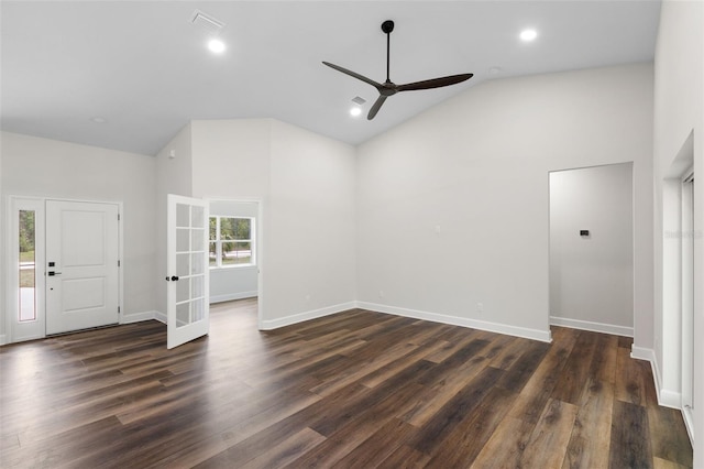 unfurnished living room with a ceiling fan, high vaulted ceiling, dark wood finished floors, and french doors