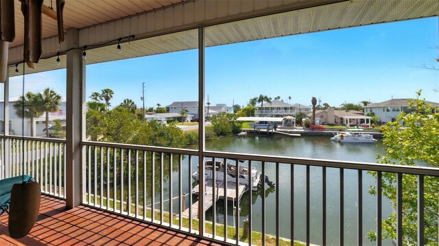 4396 5th Isle Dr, Hernando Beach, FL 34607 - wooden terrace featuring a residential view and a water view