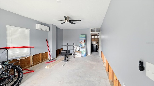 4396 5th Isle Dr, Hernando Beach, FL 34607 - interior space featuring an AC wall unit, ceiling fan, and concrete flooring