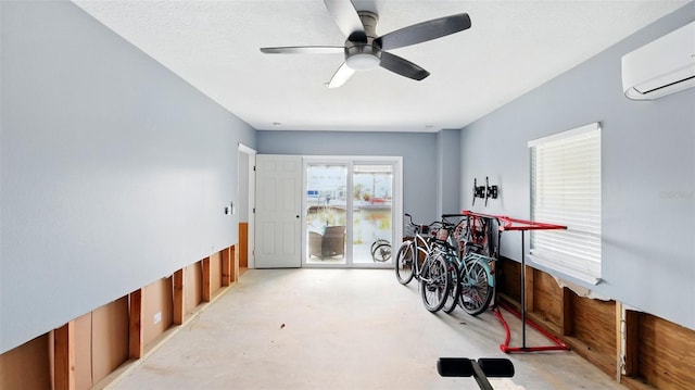 4396 5th Isle Dr, Hernando Beach, FL 34607 - misc room featuring finished concrete floors, a ceiling fan, and a wall mounted AC