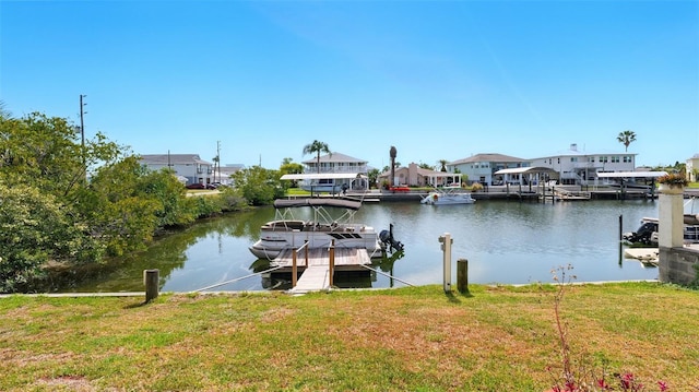 4396 5th Isle Dr, Hernando Beach, FL 34607 - view of dock featuring a lawn, a water view, and a residential view