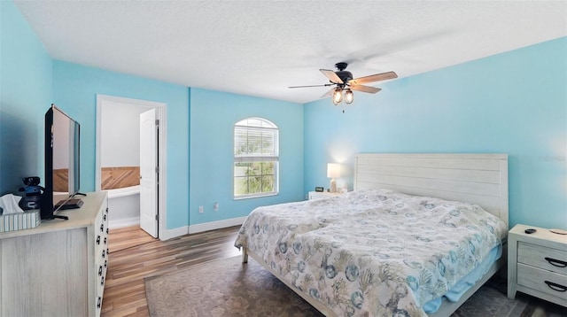 4396 5th Isle Dr, Hernando Beach, FL 34607 - bedroom featuring baseboards, a ceiling fan, and wood finished floors