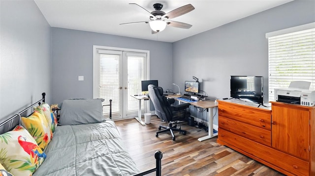 4396 5th Isle Dr, Hernando Beach, FL 34607 - office with french doors, a ceiling fan, and wood finished floors