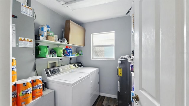 4396 5th Isle Dr, Hernando Beach, FL 34607 - washroom with baseboards, washing machine and dryer, dark wood finished floors, and electric water heater